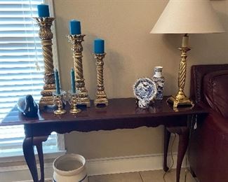 Foyer/sofa table, brass and blue decor.