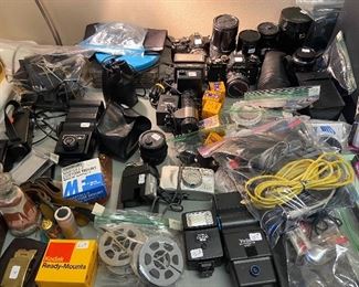 Many cameras, lenses, flashes, etc.