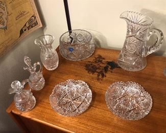 Cut crystal bowls, cruets & pitcher, Waterford vase  (Note damage to top of cabinet)
