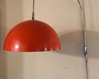 Mid century orange metal dome arc wall lamp. Shade diameter is 18; from top of arc to bottom of metal pole is 30" (has flaking white paint inside shade)