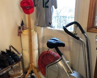Wooden coat rack, exercise bike, Seahawks jersey