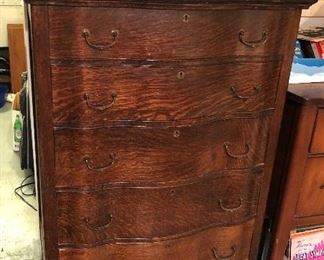 Antique serpentine front oak dresser (55”H, 34”W, 19”D,)