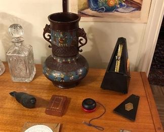 Crystal decanter,  tall champleve bronze/brass vase with elephant handles, Maelzel French metronome, Duncan yo-yo, circular slide rule