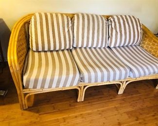 Vintage rattan sofa with curved arms & angled back (80"L, 36"D, 30" high at back)