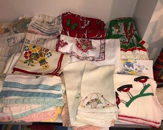 Embroidered dish towels & tea towels, vintage screenprint tablecloths (one Xmas), card table covers 