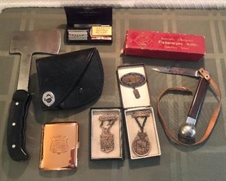 Vintage Buck 106 hatchet + leather sheath, Alaska copper cigarette case, Valet AutoStrop razor in case, Puma Fisherman’s knife + box, 1920s shooting medals