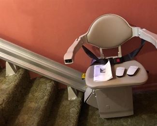Bruno stair lift - Model SRE-3000, manuf. Nov. 2017  (300 lbs. max.) with 11 ft. of straight track,  2 remotes & manual. Not hard wired - plugs into wall.