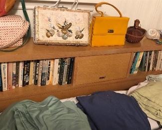 Vintage full size (double) bed. Headboard has built-in shelves & door at center that lifts. With plain footboard. 57”L, 37”H, 8.5”D)