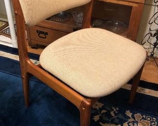One of set of 4 Benny Linden teak dining chairs  - 22”D, 20”W, 30.5” high at back (upholstery on 2 of the 4 is stained)