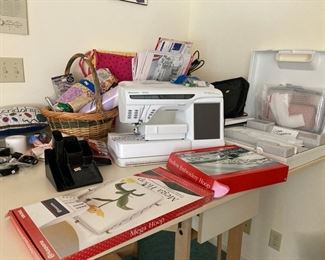 Viking Designer SE sewing machine with embroidery module and accessories. The machine needs a new circuit board.