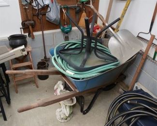 wheel barrow, hose, shovel, rakes, step ladder, more