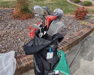Ping golf bag and left-handed golf clubs