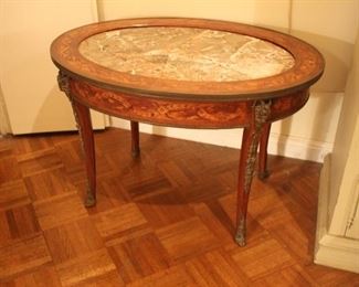 Marquetry cocktail table with figural bronze mounts and marble top