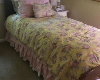 Twin bed. Floral linens