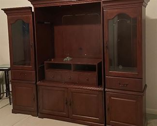 Lighted Entertainment Center Beautiful Mahogany Piece that Can be Separated to Create a Distinct Look, This Item is Located at the home in the Lakes and Still Available
