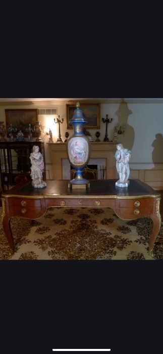 Large Antique Louis XV Inlaid & Bronze Mounted Bureau Plat  with tooled leather top. 
Antique Large Imposing Palace Sized 43 inch SEVRES Vase signed by the artist.

Large pair of Antique Porceline Bisque Figures beautifully decorated. 