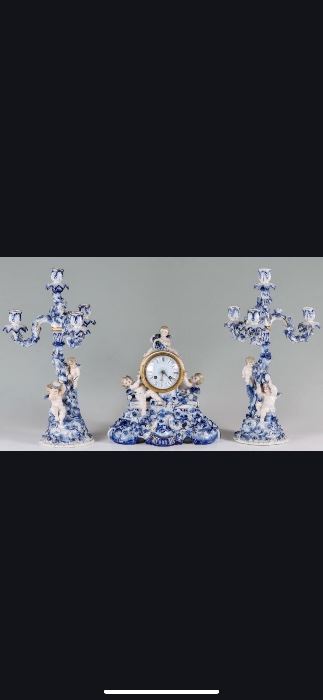 Tiffany Porceline 3 Piece Clock Garniture Surmounted with Cherubs. 
DECOMMISSIONED FROM A FL MUSEUM