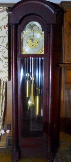 Very Nice TIFFANY Chiming Grandfather clock with Westminster, Whittington  and St Michael chimes in original condition. Pillared Mahogany Case with Beveled Glass front and sides. 