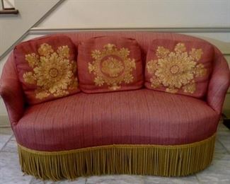 Rare 19th Century Victorian Settee with Rosewood legs. Beautifully Upholstered with pink  striead fabric with boullion fringe. Length 58”. Height 30 inches. 