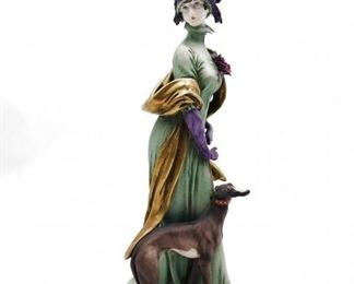 CAPODIMONTE GIUSEPPE CAPPE LADY WITH ITALIAN GREYHOUND DOG FIGURINE ITALY SIGNED $550 plus shipping                                                                          This is a superb Italian porcelain bisque figure of a beautiful woman dressed very fashionably with her gorgeous Italian greyhound by her side. She wears a long green gown with a fabulous purple feather plumed hat and gloves and a gold gilt long scarf draped around her and partially resting on her dog. 
 
DETAILS:
Giuseppe Cappe
Signed G. Cappe Works of Art
dated 1959
10" tall
 
Condition:  Excellent.  There is a tiny nick on the end of her pointer finger and the end of one feather in her hat is broken at the end.  