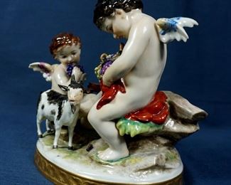ANTIQUE GERMAN DRESDEN VOLKSTEDT 2 CHERUBS WITH GOAT FIGURINE 7" X 5.5" X 7.5" H  $275 plus shipping
 
 
DETAILS:
Antique (Circa early 1900's)
German Dresden Volkstedt 
Aelteste Volkstedter Porzellanfabrik
 2 Cherubs with Goat 
Measurement: 7" x 5.5" x 7" H
Blue Crown Over Double R and 1762 with "V 1936" Marking
 
Condition:  Overall very good physical condition. No noticeable wear or chips or cracks. Minor dust accumulated in crevices. Minor scuffs on base from being displayed.