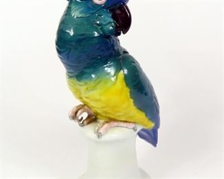 ANTIQUE CENTURY GERMAN PORCELAIN PARROT GREEN BIRD BLUE FEATHER HEAD 15" H $285 plus shipping
 
Details:
Antique (18th Century) 
Porcelain 
Parrot
Green Feather Body with Blue Feather on Head
Measurements:
~15" H (tip of the feather on head)
~8.5" W (tail end to feather tip on head) 
~6" x 5" Plinth Base 
Made in Germany
 
Condition: Parrot is in very good physical condition. Plinth base has an early repair with staples and restoration marked with # 4966 1. Appears to be made by Meissen or Karl Ens.