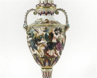 19c CAPODIMONTE COVERED URN MYTHOLOGICAL BATTLE SCENE  $350 plus shipping
 
 
Elaborate antique covered urn.  Top of the urn has a reticulated and open work cover on top of which is a renaissance type helmet or helm.  The body of the vase is decorated in a mythological battle scene between centaurs and men.  The base of the vase is decorated with warring cherubs.
 
DETAILS:
19th century
14.5" high
signed with crowned "N" under glaze blue
 
Condition:  Excellent. Repair on top, unnoticeable. There is a slight chip on one of the feathers on the helmet. 