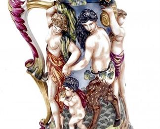 CAPIDOMONTE POLYCHROME PORCELAIN WINE STEIN MUG JAR IN HIGH RELIEF 18TH CENT $428 plus shipping
 
 
DETAILS:
Characters are holding the god Baco
Original Lid ornamented with grapes
12.5" x 8"
High relief
 
Condition:  Excellent condition.  Amazing piece.  No chips, cracks or repairs