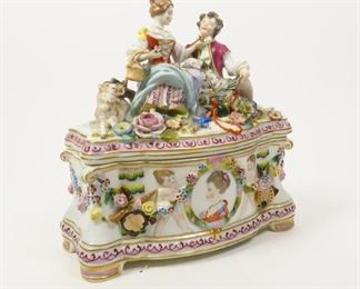 ANTIQUE FIGURAL HAND PAINTED PORCELAIN DRESDEN CASKET BOX VIENNA 1880 - 1900      $225 plus shipping
 
A young couple rests among big beautiful flowers as a little lamb sits next to them looking up. The woman is holding a rose up to the man as he looks at her.  The base has the portrait of a young woman in the center with a cherub on either side. There are lovely floral swags all the way around the box, intertwined with musical instruments. 
 
DETAILS:
Dresden Casket Box
Circa 1880 - 1900
Hand Painted Porcelain 
Measurements: ~9" x ~9"
Marked on Bottom 
 
Condition:  Antique.  No visible chips or cracks. Shows some minor imperfections.
