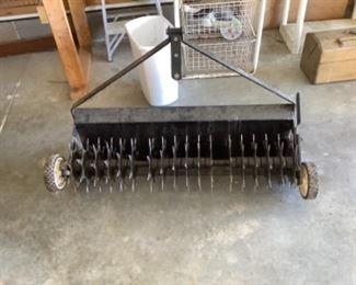 Pull behind lawn aerator 