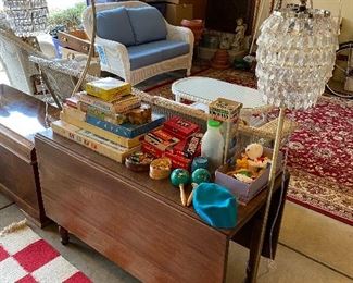 Drop-leaf table; sampling of the vintage toys and games to be sold; fun pair of matching floor lamps.