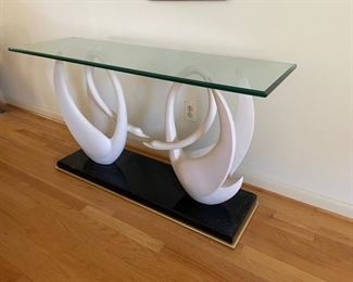 $750                                                                                                          FRENCH VINTAGE SWAN TABLE MAISON JANSEN STYLE IN BRASS & GLASS 1970's
OFFERS CONSIDERED
This beautiful table is believed to be manufactured by Maison Jansen. It has a solid black and gilt base with a set of composite Swans and a thick beveled glass top. Both Swan’s are in very good condition as is the base and table top.  This is an exquisite piece, a lovely and graceful focal point.
DETAILS + DIMENSIONS:
50"L X 16"D X 27"H
CONDITION: This piece has been very well cared for and is in very good condition. Please refer to photo's for a more detailed look at condition.  We make every attempt to list and photograph any defects or signs of wear that are significant to this sale. 
LOCAL PICK UP BOYDS, MD. (PIECE IS ON THE FIRST FLOOR WITH EASY ACCESS)  BUYER IS RESPONSIBLE FOR ANY NECESSARY DISASSEMBLY AND ALL COSTS ASSOCIATED WITH SHIPPING OR PICK UP.  THIS IS A VERY