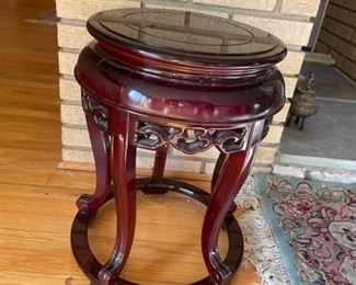 $50                                                                                                                 CARVED ROSEWOOD TABLE SMALL ACCENT TABLE/ PLANT OR CANDLE STAND
**OFFERS CONSIDERED
This beautiful wood stand, along with your favorite flowerpot or vase, will create an instant centerpiece in any room. Hand rubbed dark brown finish.
DETAILS + DIMENSIONS:
16"X16"X12"
CONDITION: This piece has been well cared for and are in very good condition. There is a crack in the finish on one edge. Please refer to photo's for a more detailed look at condition.  We make every attempt to list and photograph any defects or signs of wear that are significant to this sale. 
LOCAL PICK UP BOYDS, MD. (PIECE IS ON THE FIRST FLOOR WITH EASY ACCESS)  BUYER IS RESPONSIBLE FOR ANY NECESSARY DISASSEMBLY AND ALL COSTS ASSOCIATED WITH SHIPPING OR PICK UP.       