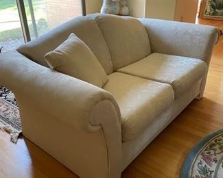 $250      NOW  $ 125.00                                                                                                                 2 CUSHION LOVESEAT IN A CREME FINE TONAL FABRIC WITH FLARED AND ROLLED ARMS - OFFERS CONSIDERED
This Traditional Fabric Loveseat will add function and comfortable seating to any room of your home. A small couch that has a timeless silhouette with updated details that fits a variety of home interior décor styles. The clean lines and soft tonal upholstery add to its classic style.
THIS IS PART OF A SET.  WE ARE SELLING THE MATCHING THREE-CUSHION SOFA AS WELL.  PLEASE MESSAGE US FOR DETAILS.
DETAILS + DIMENSIONS:
68"L X 36"H X 28"D
CONDITION: This piece has been well cared for and are in very good condition. No stains or tears in upholstery.  Please refer to photo's for a more detailed look at condition.  We make every attempt to list and photograph any defects or signs of wear that are significant to this sale. 
LOCAL PICK UP BOYDS, MD. (PIECE IS ON THE 