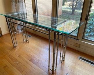 $450                                                                                                                    ITALIAN 1970'S CHROME & GLASS CONSOLE W/ CHROME FAUX BAMBOO WRAP MOUNTS
**OFFERS CONSIDERED
Italian 1970s chrome & glass console with chrome faux bamboo mounts. Round trellis frame with a thick glass top raised on a total of 12 "bamboo" legs with faux bamboo wrap mounts, reminiscent of Gucci.
DETAILS + DIMENSIONS:
54"L X 16"W X 28"H
CONDITION: This piece has been well cared for and are in very good condition. Please refer to photo's for a more detailed look at condition.  We make every attempt to list and photograph any defects or signs of wear that are significant to this sale. 
LOCAL PICK UP BOYDS, MD. (PIECE IS ON THE FIRST FLOOR WITH EASY ACCESS)  BUYER IS RESPONSIBLE FOR ANY NECESSARY DISASSEMBLY AND ALL COSTS ASSOCIATED WITH SHIPPING OR PICK UP.    