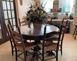 ROUND PEDISTAL DINING/KITCHEN TABLE AND THE 6 LADDER BACK CHAIRS