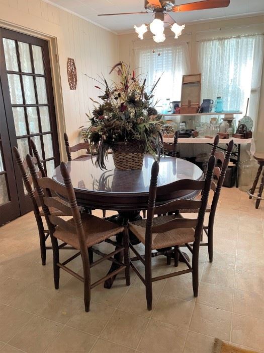 ROUND PEDISTAL DINING/KITCHEN TABLE AND THE 6 LADDER BACK CHAIRS