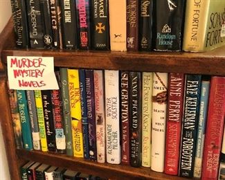 Tons of tons of books. This photo shows a select few murder mysteries, all hardback. There are also soft back books available