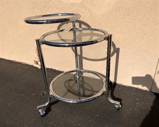 #3623 Swinging top chrome table attributed to Gilbert Rohde