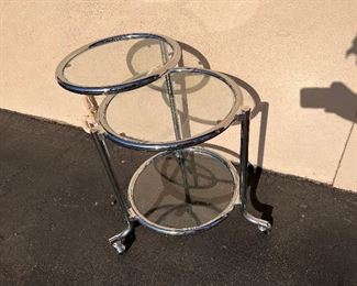 #3623 Swinging top chrome table attributed to Gilbert Rohde