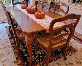 Kitchen table and chairs. Table measures 30" high x 43" wide x 85" long. 6 chairs total. 2 armchairs measure 40" high x 23" wide x 20" deep. 4 side chairs measure 40" high x 22" wide x 19" deep.
