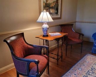 Red upholstered chairs. 35" high x 24" wide x 22" deep.