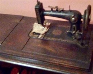 Antique Singer in cabinet.  (Better picture is coming)