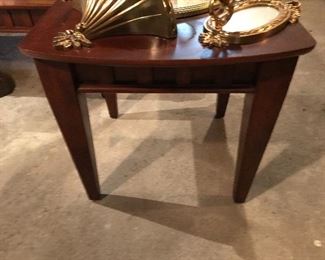 One of two contemporary end tables and matching coffee table