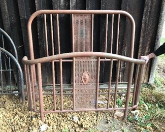 Iron bed with curved footboard