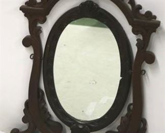 2598 - Carved walnut Victorian oval mirror in rack 44 x 36
