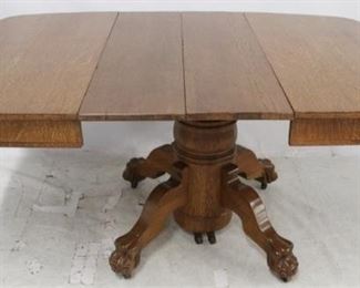 3277 - Oak claw foot pedestal base table w/ 2 leaves 29 1/2 x 43 x 42

