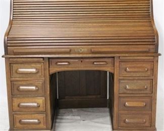 3281 - Oak S roll top raised panel desk 48 1/2 x 50 x 31 1/2
