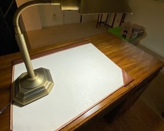 Desktop with brass lamp