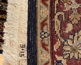 Underside of rug mark